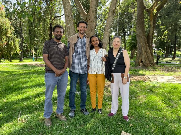 Group picture in pasture with trees in the background