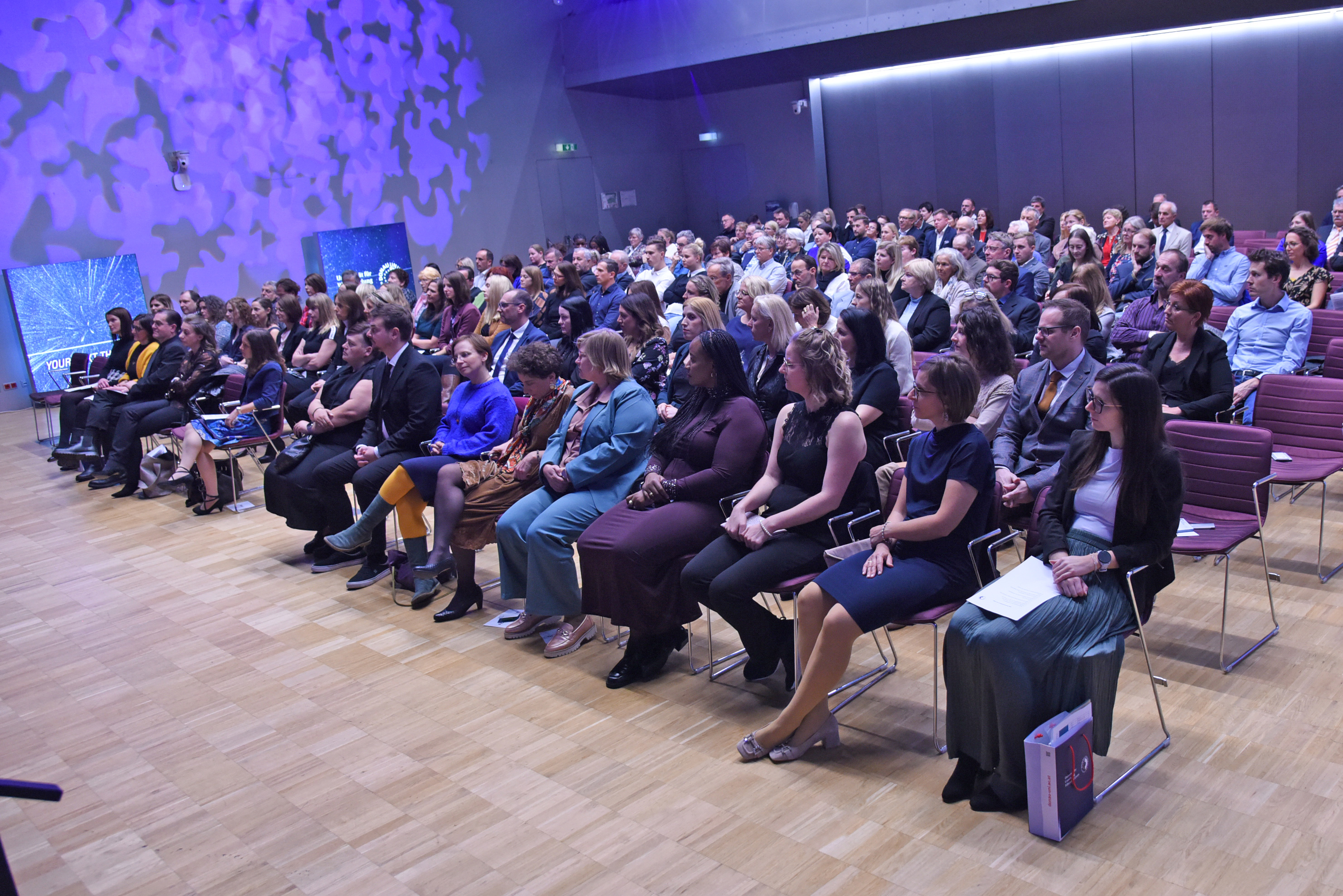 Graduates and guests of honor in the Audimax